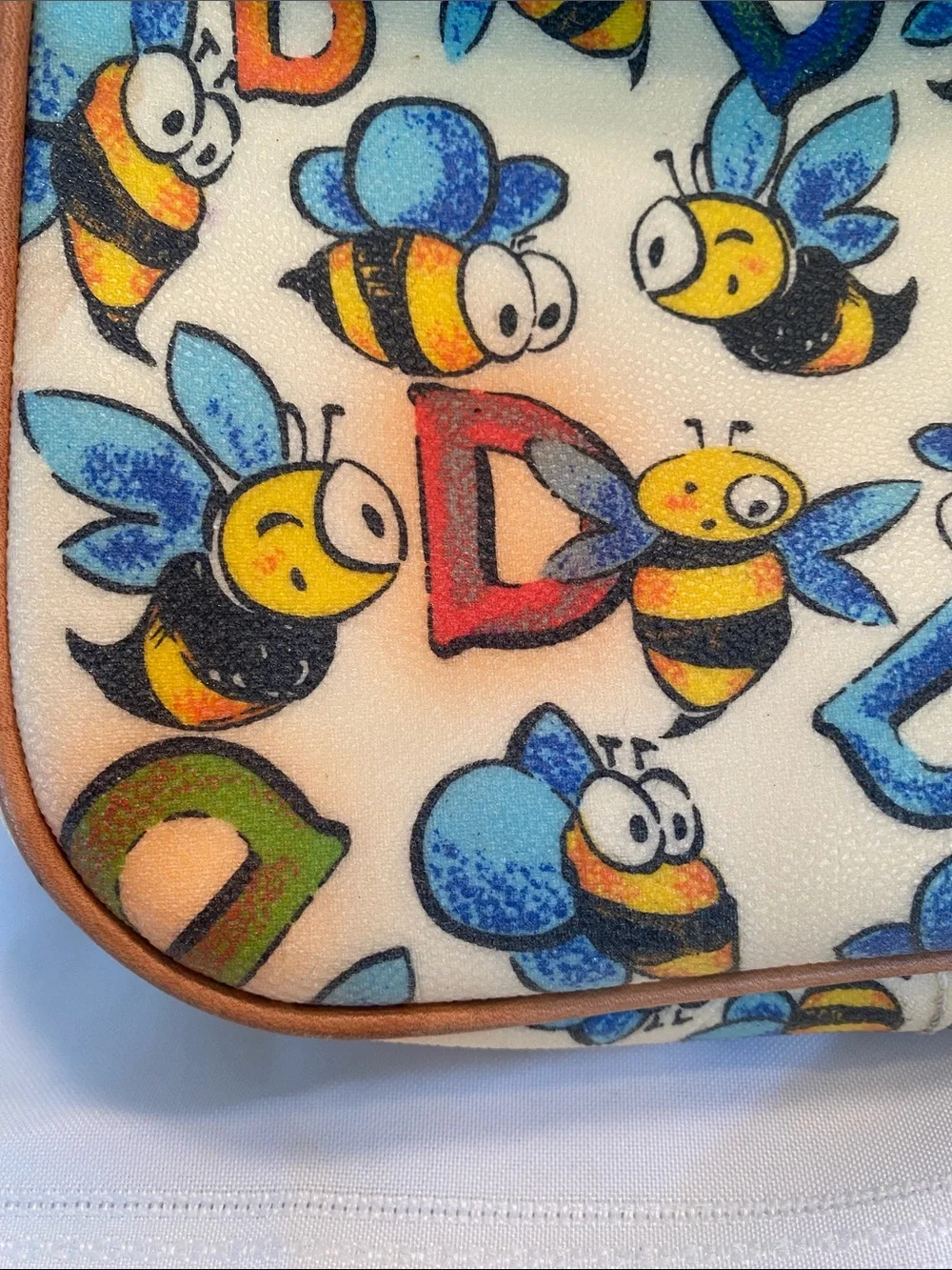 Dooney & Bourke Bee Print Satchel in Tan and Cream with Blue & Yellow Accents